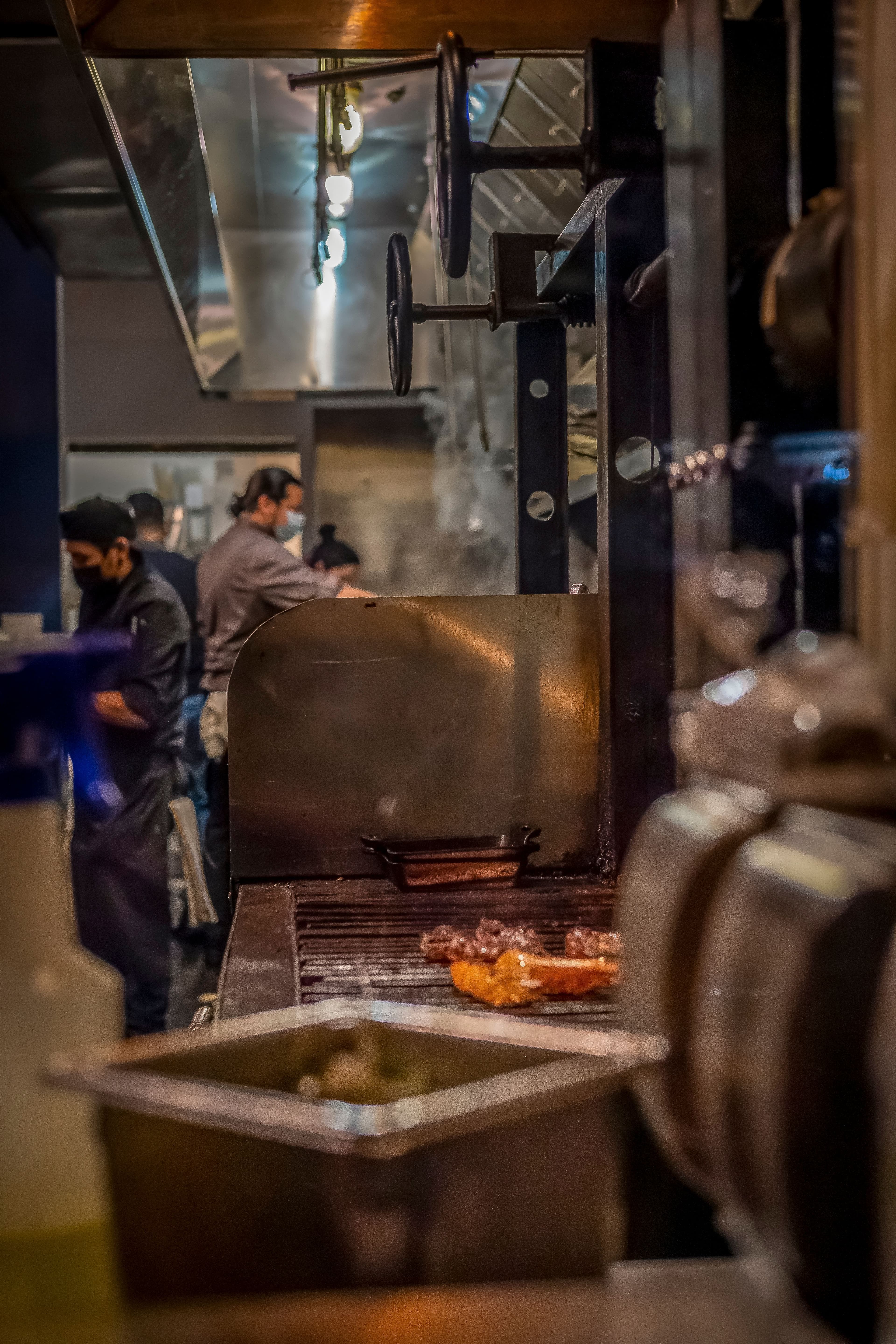 Restaurant kitchen team working the cookline